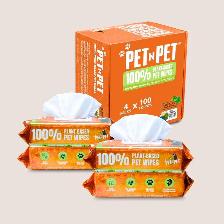 Pet n Pet plant-based pet wipes box with four 100-count individual packs displayed showing orange branding and natural ingredient certification.