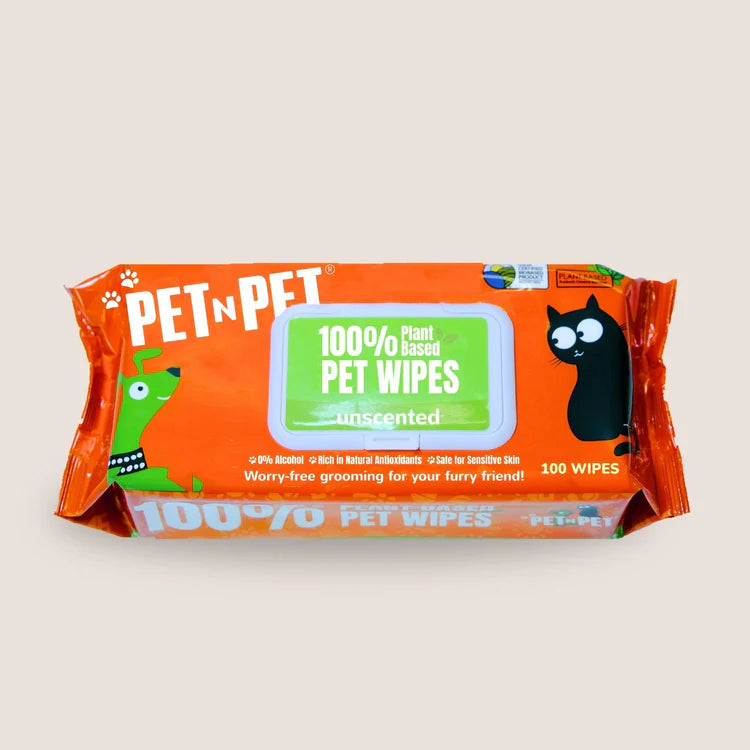 Pet n Pet 100% plant-based unscented pet wipes package with orange branding, cartoon cat and dog illustrations, natural ingredients list, and 100-count wipes.