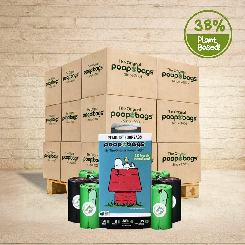 The Original Poop Bags wholesale pallet with Peanuts Snoopy themed 120-count retail box and black and green bag rolls.