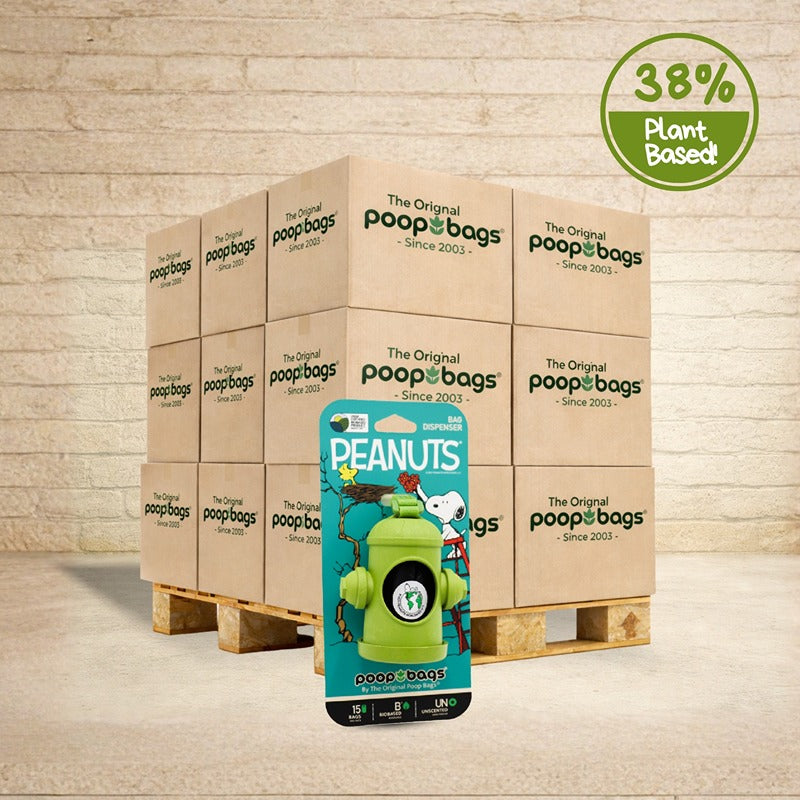 The Original Poop Bags wholesale pallet with Peanuts Snoopy dog poop bag dispenser featuring green bone-shaped holder and 15 bags.