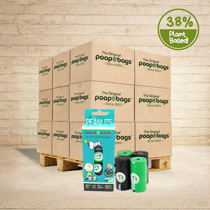 Pallet of The Original Poop Bags wholesale cases with Peanuts-branded retail box and black and green bag rolls in front.