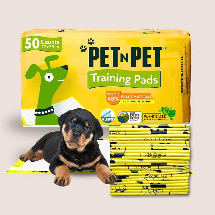 Pet n Pet dog training pads in 50 count pack, 22x23-inch size made with 48% plant material and 5-layer protection with a rottweiler dog