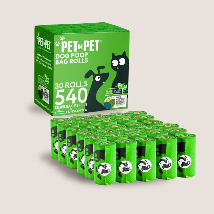 Pet n Pet dog poop bag rolls featuring 30 rolls with 540 bags in vibrant green packaging, showcasing cartoon cat and dog design with plant-based certification and colorful refill dispensers.